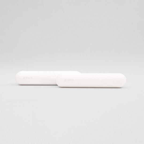 A pair of white dumbbells on a white background, designed for fitness and home exercise.