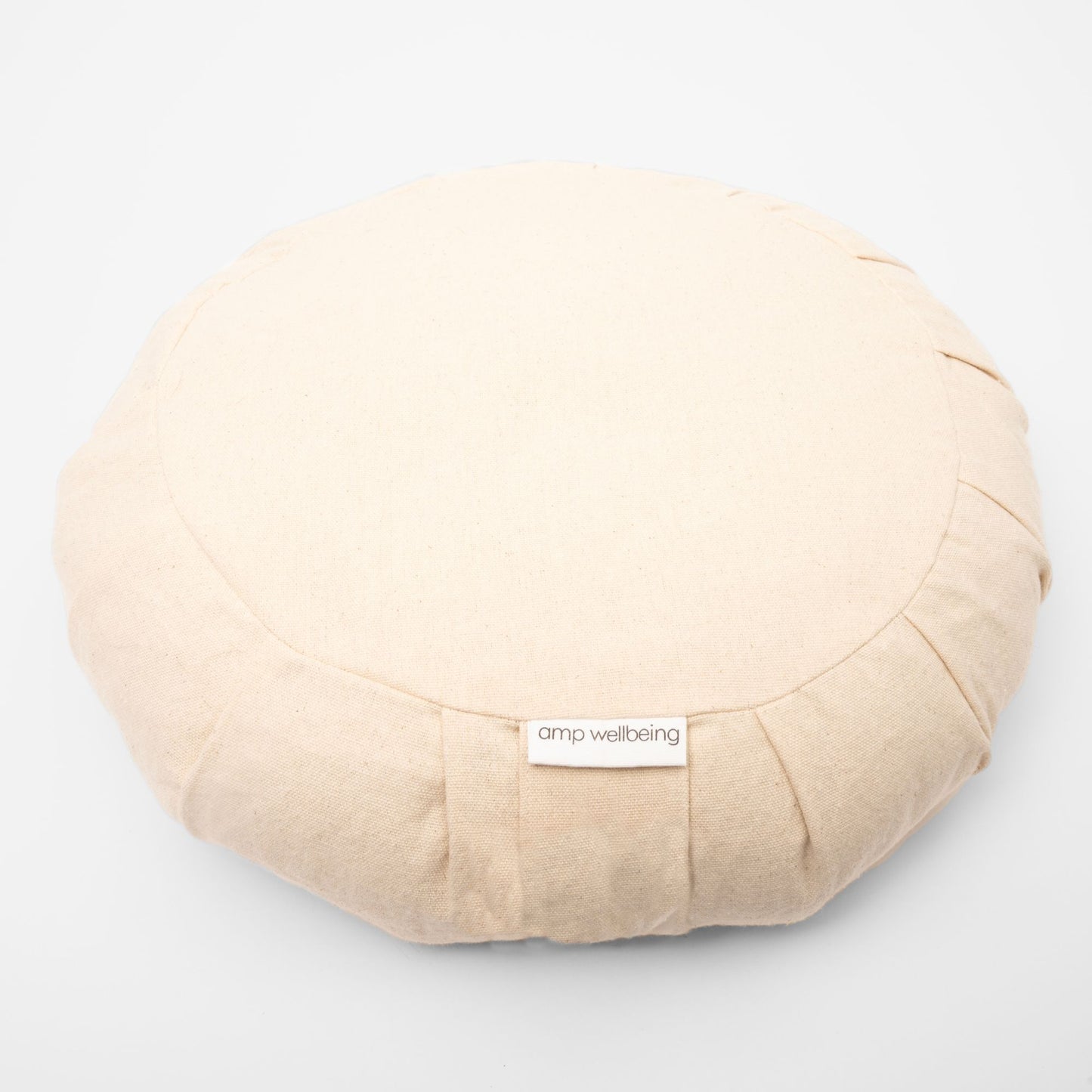 Beige meditation cushion with 'amp wellbeing' 