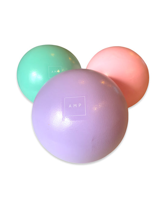 Pilates balls in pink, green and purple